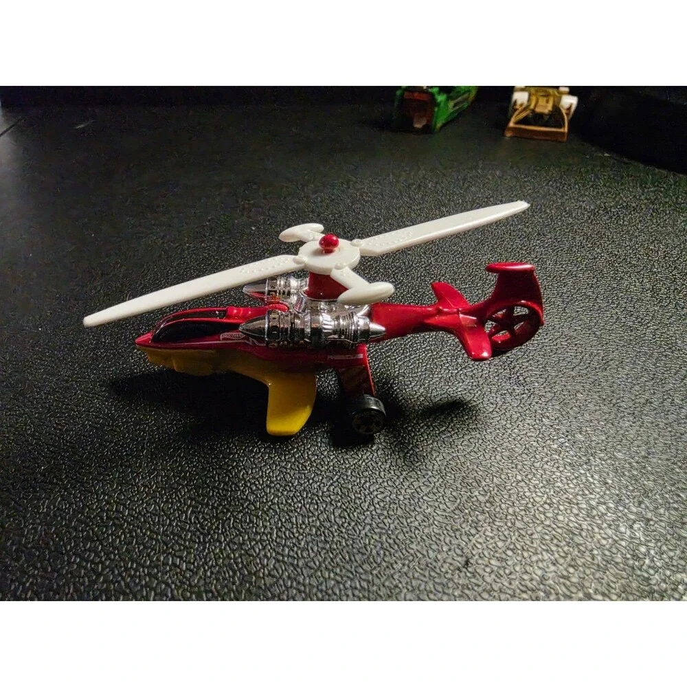 Lot of 4 loose Hot Wheels vehicles in pre-owned condition.